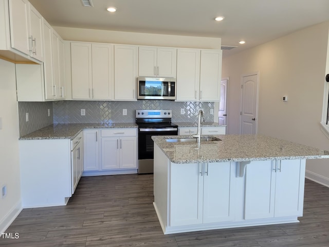 3612 Tarmac Rd Unit Ep 127, Wilson, NC 27896 - kitchen with appliances with stainless steel finishes, a sink, dark wood-type flooring, white cabinetry, and light stone counters
