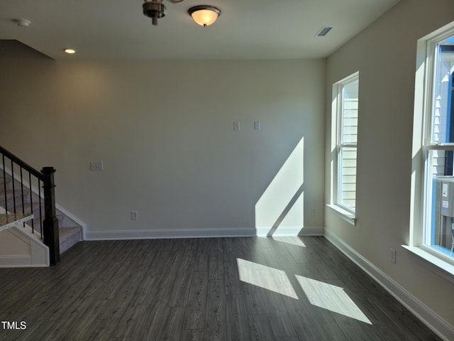 3612 Tarmac Rd Unit Ep 127, Wilson, NC 27896 - unfurnished living room featuring dark wood-type flooring, stairway, baseboards, and recessed lighting