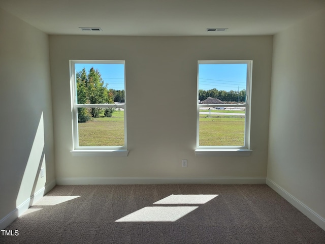 3612 Tarmac Rd Unit Ep 127, Wilson, NC 27896 - carpeted spare room with baseboards and plenty of natural light