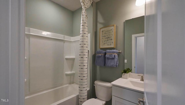 full bathroom featuring vanity, washtub / shower combination, and toilet