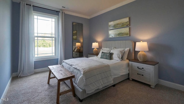 bedroom with ornamental molding and light colored carpet