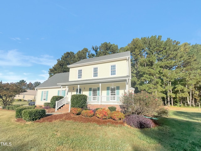 view of front of property with a front yard and a porch