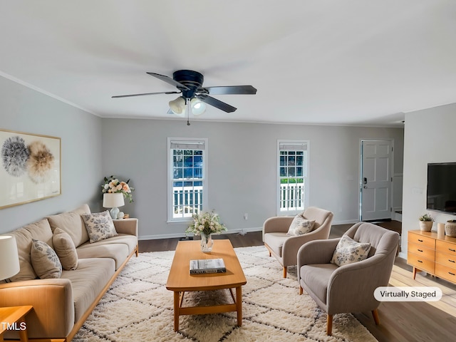 living room with ceiling fan, crown molding, and hardwood / wood-style floors