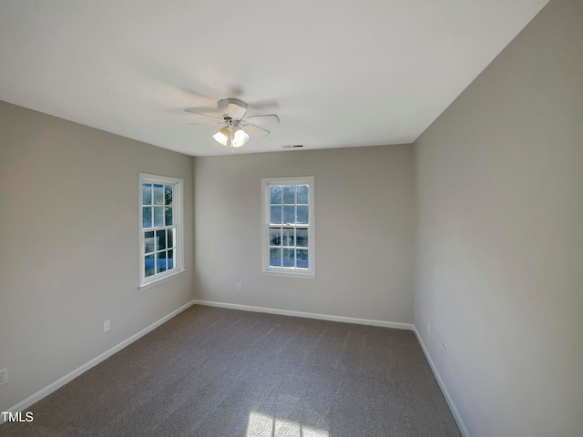 unfurnished room with carpet flooring and ceiling fan