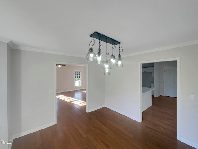 unfurnished dining area with ornamental molding and dark hardwood / wood-style floors