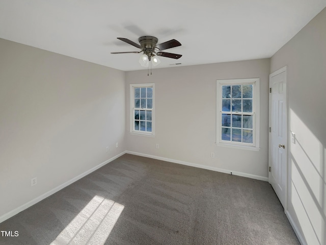 carpeted spare room with ceiling fan