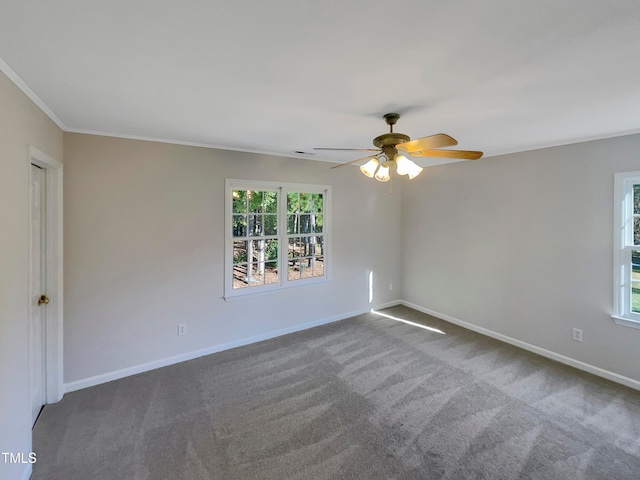 carpeted empty room with crown molding and ceiling fan