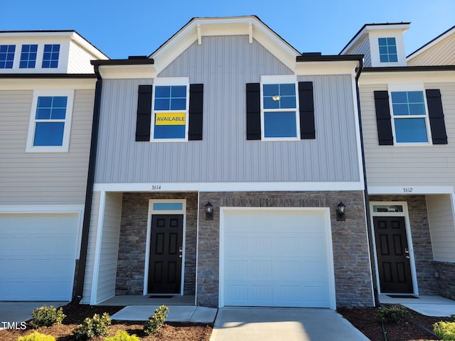 3614 Tarmac Rd Unit Ep 128, Wilson, NC 27896 - townhome / multi-family property featuring stone siding, a garage, and driveway