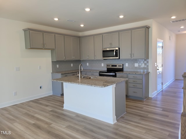 3614 Tarmac Rd Unit Ep 128, Wilson, NC 27896 - kitchen featuring appliances with stainless steel finishes, gray cabinets, a sink, light stone counters, and recessed lighting