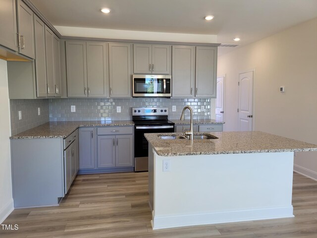 3614 Tarmac Rd Unit Ep 128, Wilson, NC 27896 - kitchen featuring stainless steel appliances, a sink, gray cabinets, light stone countertops, and recessed lighting