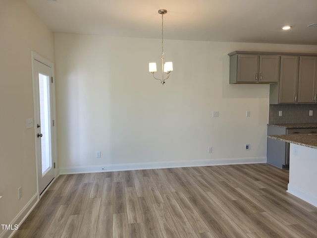 3614 Tarmac Rd Unit Ep 128, Wilson, NC 27896 - unfurnished dining area with light wood finished floors, a chandelier, baseboards, and recessed lighting