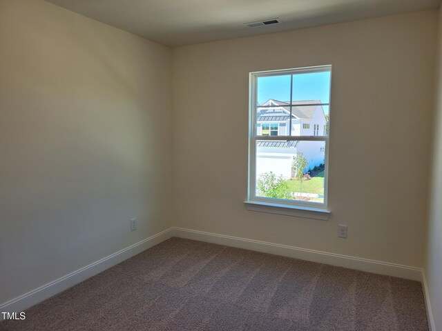 3614 Tarmac Rd Unit Ep 128, Wilson, NC 27896 - empty room featuring dark colored carpet and baseboards