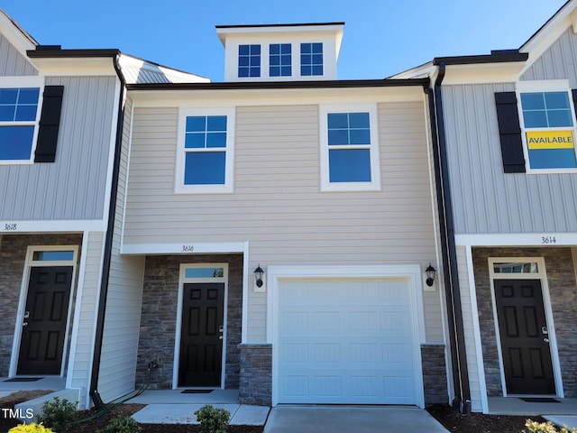 3616 Tarmac Rd Unit Ep 129, Wilson, NC 27896 - townhome / multi-family property featuring stone siding, board and batten siding, and a garage