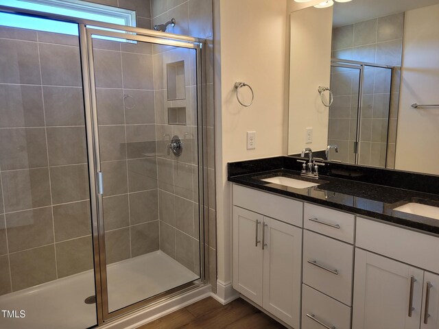3616 Tarmac Rd Unit Ep 129, Wilson, NC 27896 - bathroom with a shower stall, double vanity, and wood finished floors
