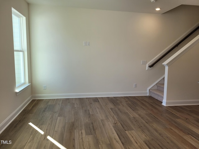 3618 Tarmac Rd Unit Ep 130, Wilson, NC 27896 - unfurnished living room featuring plenty of natural light, wood finished floors, and stairway