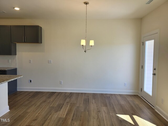 3618 Tarmac Rd Unit Ep 130, Wilson, NC 27896 - unfurnished dining area with dark wood-style flooring, baseboards, a chandelier, and recessed lighting