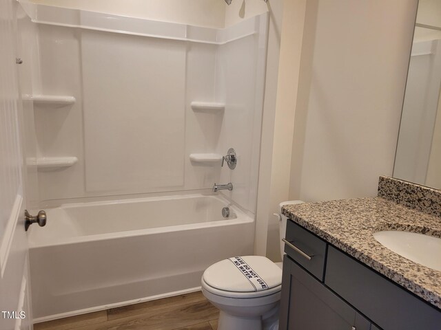 3618 Tarmac Rd Unit Ep 130, Wilson, NC 27896 - bathroom featuring vanity, bathing tub / shower combination, toilet, and wood finished floors