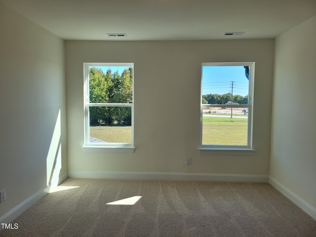 3618 Tarmac Rd Unit Ep 130, Wilson, NC 27896 - unfurnished room featuring carpet flooring, healthy amount of natural light, and baseboards