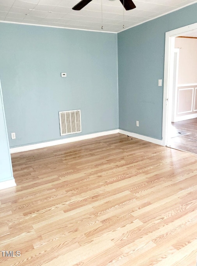 unfurnished room featuring light hardwood / wood-style floors and ceiling fan