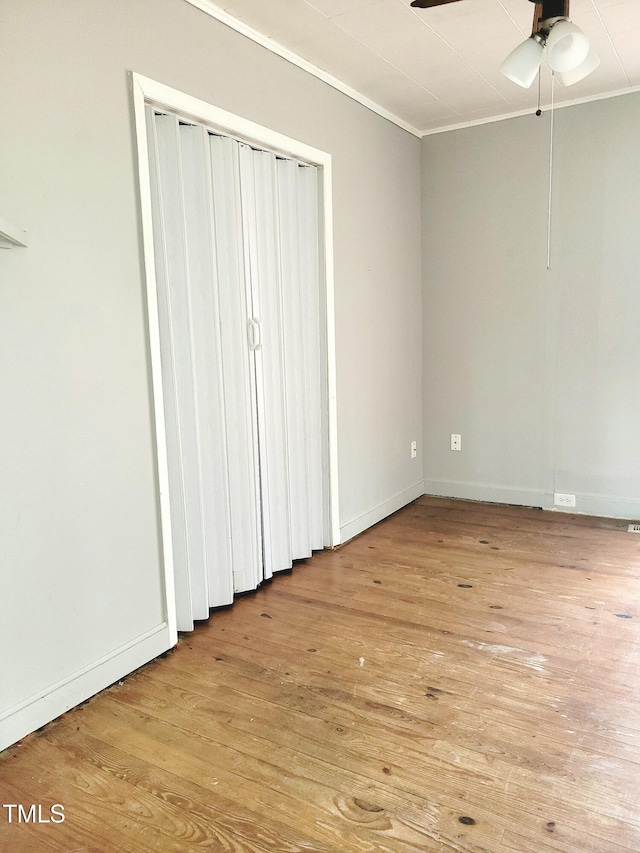 unfurnished bedroom with ornamental molding, ceiling fan, and light hardwood / wood-style flooring