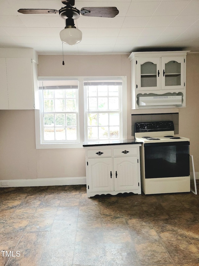 kitchen featuring white cabinets, white range with electric cooktop, ceiling fan, and exhaust hood