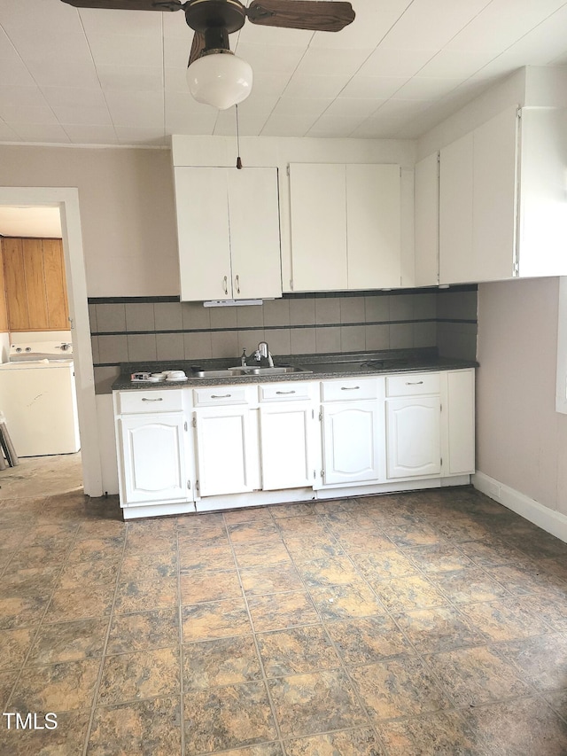 325 Ranch Farm Rd Unit A B, Raleigh, NC 27603 - kitchen with washer / clothes dryer, dark countertops, white cabinetry, backsplash, and ceiling fan