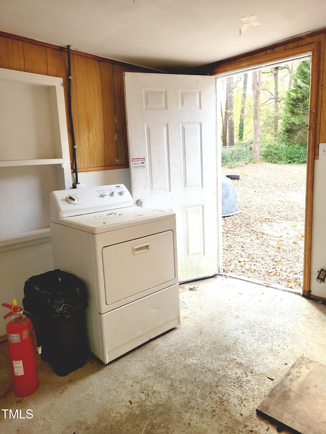 clothes washing area with washer / dryer