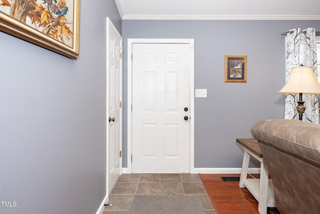 foyer entrance featuring ornamental molding