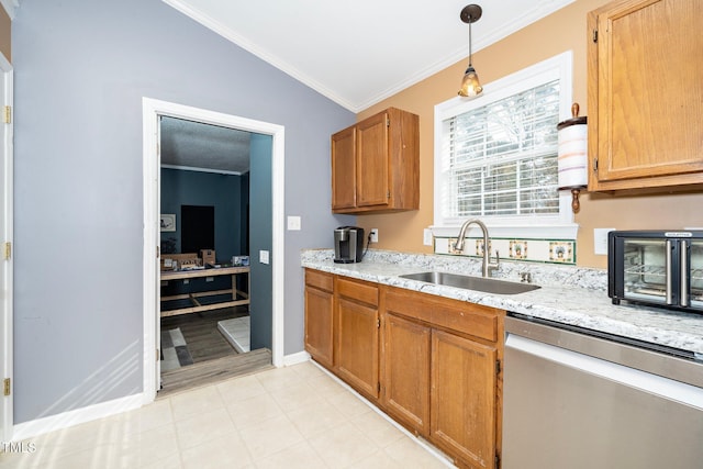 kitchen with vaulted ceiling, decorative light fixtures, sink, ornamental molding, and stainless steel dishwasher