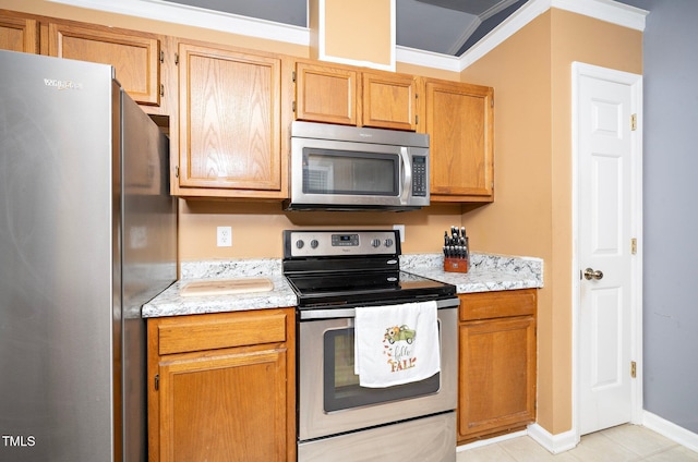 kitchen with light tile patterned floors, crown molding, stainless steel appliances, and light stone countertops