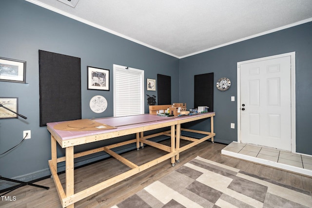 dining room with ornamental molding and wood-type flooring