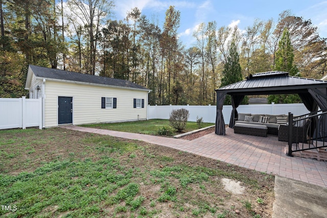 view of yard with an outbuilding, a gazebo, outdoor lounge area, and a patio