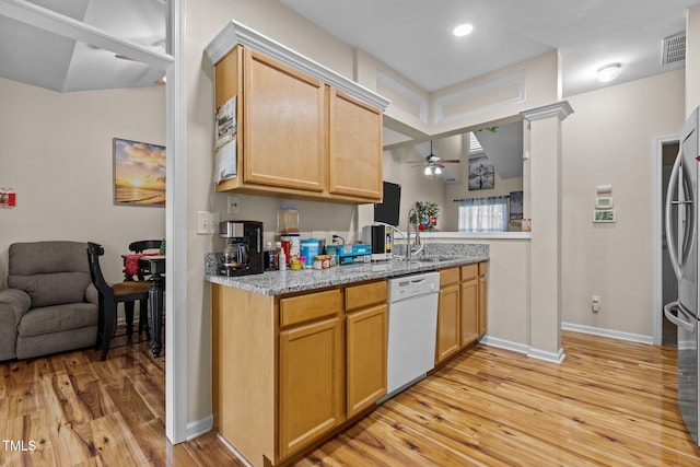 kitchen with light brown cabinetry, dishwasher, light wood-type flooring, and ceiling fan