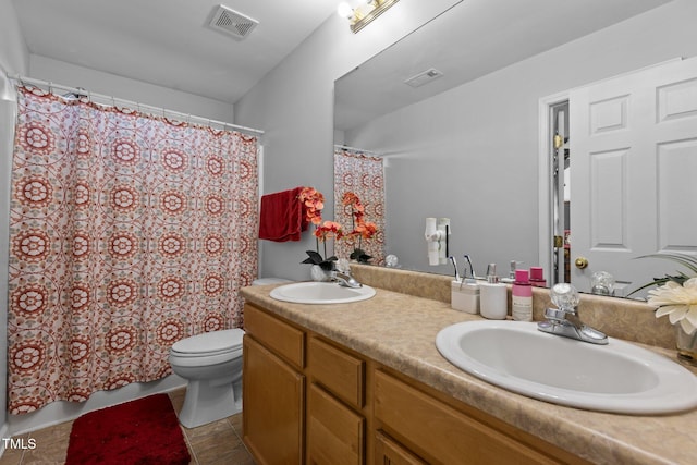 bathroom with toilet, vanity, a shower with shower curtain, and tile patterned flooring