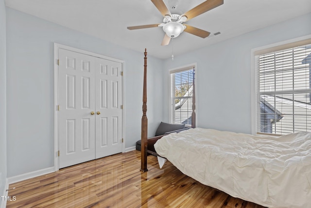 bedroom featuring a closet, ceiling fan, and wood-type flooring