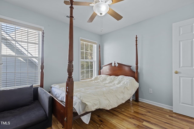 bedroom featuring hardwood / wood-style flooring and ceiling fan