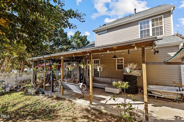 back of house with a patio area