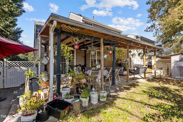 rear view of house featuring a patio and ceiling fan