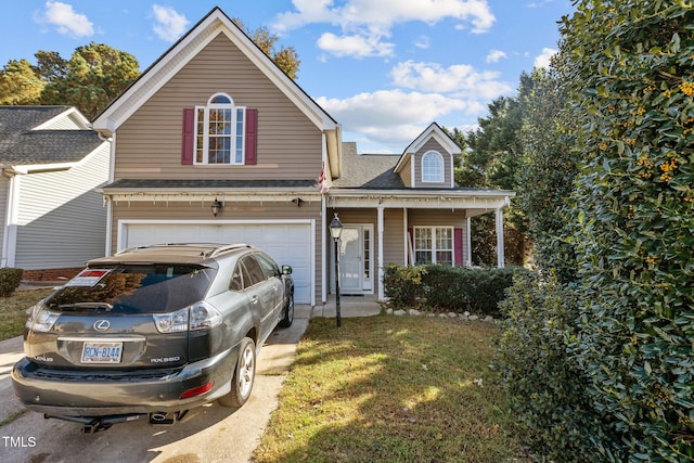 view of front property featuring a front yard and a garage