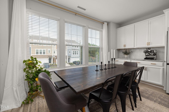 dining space featuring light hardwood / wood-style floors