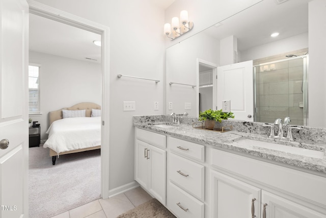 bathroom with vanity, tile patterned flooring, and walk in shower