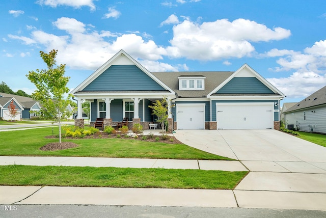 craftsman-style home with a front yard and covered porch