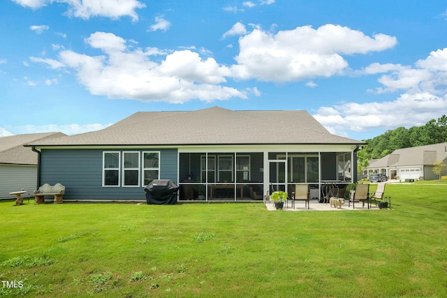 back of property featuring a patio, a yard, and a sunroom