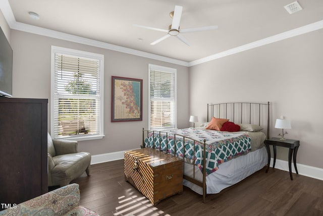 bedroom with dark wood-type flooring, ceiling fan, and crown molding