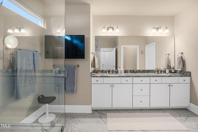 bathroom featuring vanity and a shower with door