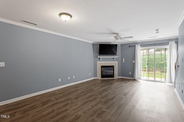 unfurnished living room featuring hardwood / wood-style flooring, ceiling fan, and ornamental molding