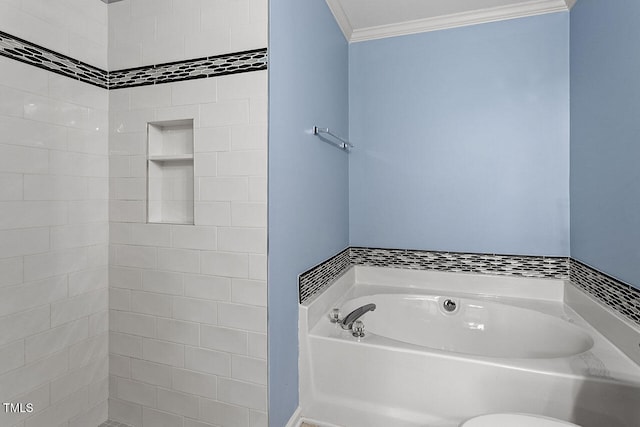 bathroom featuring a bath and crown molding