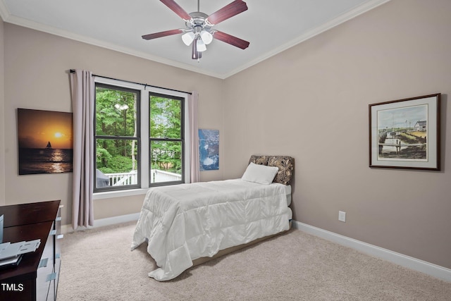 bedroom featuring crown molding, light carpet, and ceiling fan