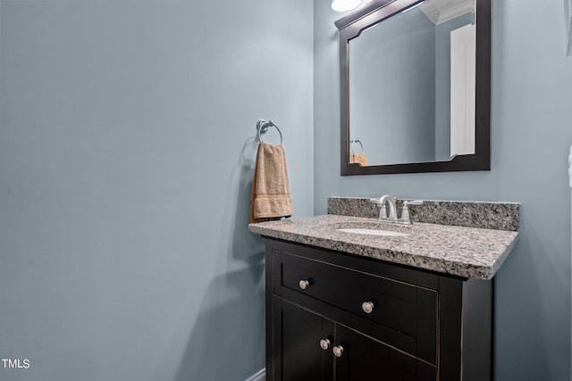 bathroom with vanity and crown molding