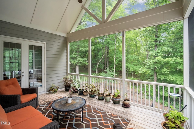 sunroom featuring lofted ceiling